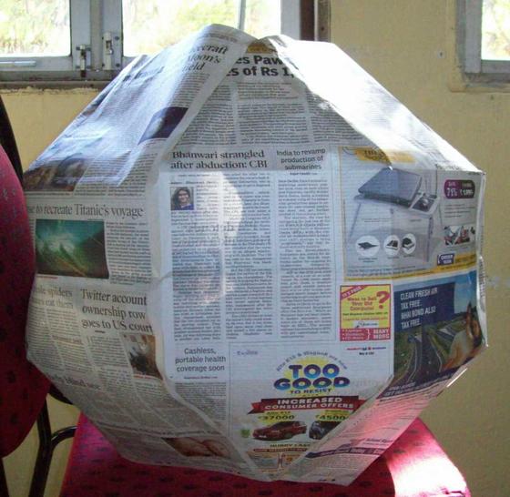 Rhombicuboctahedron made of newspaper broadsheets